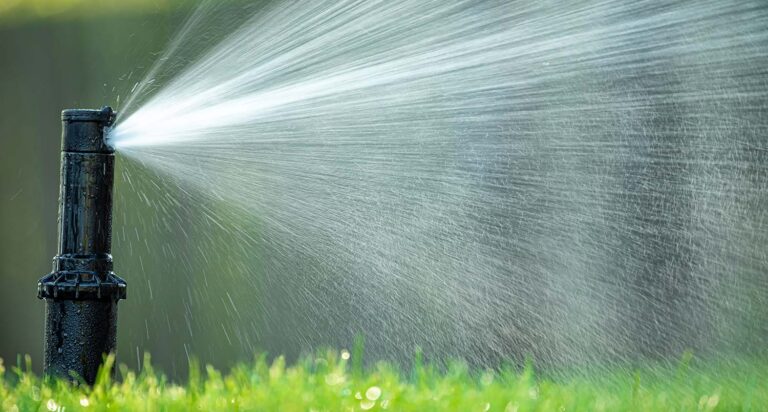 How do you unclog a lawn sprinkler system?