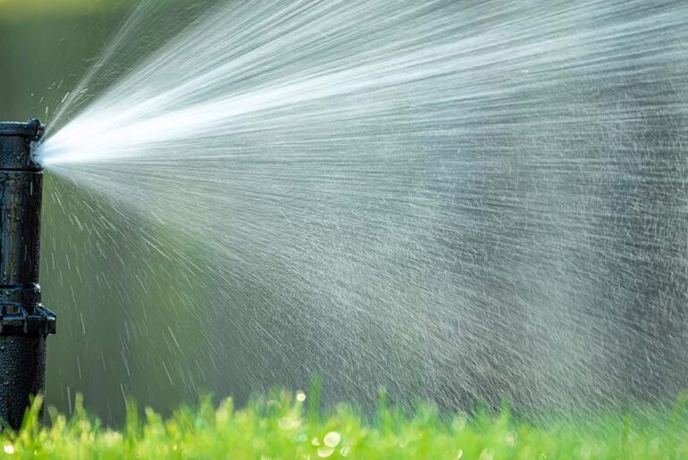 How do you unclog a lawn sprinkler system