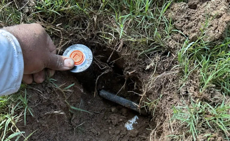 How to cut grass around sprinkler heads without damaging them?